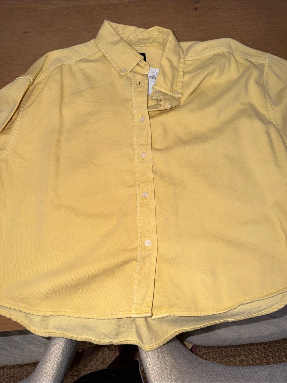 Women’s yellow button down shirt